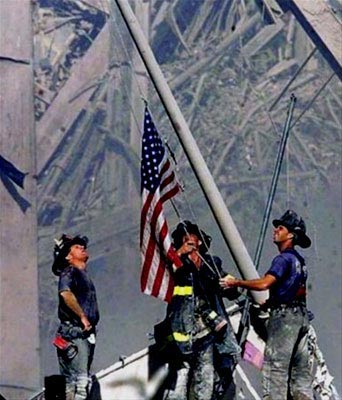 Firefighters raise the American Flag at Ground Zero