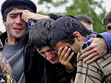 Mourners grieve the loss of hundreds in Belsan, Russia 
